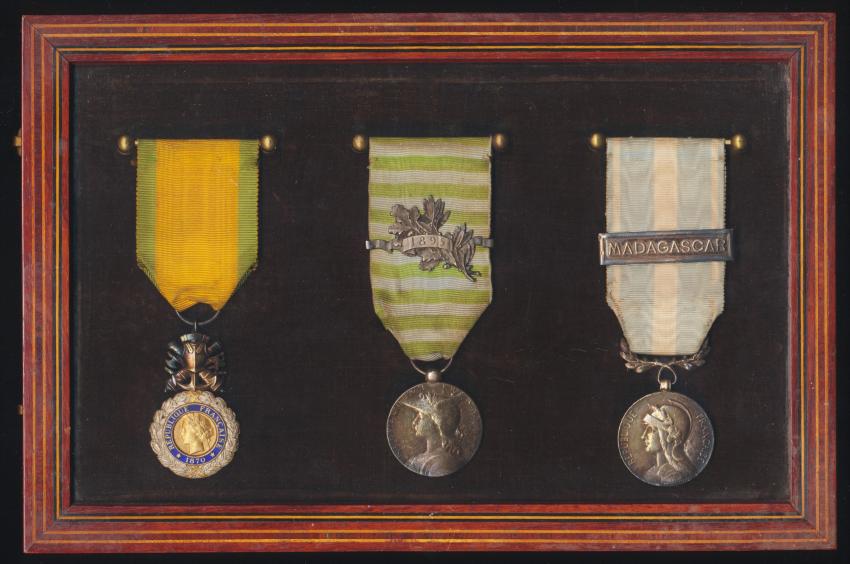 France: An unattributed distinguished 'Madagascar' colonial service medal group of 3 mounted in a contemporary glazed glazed frame