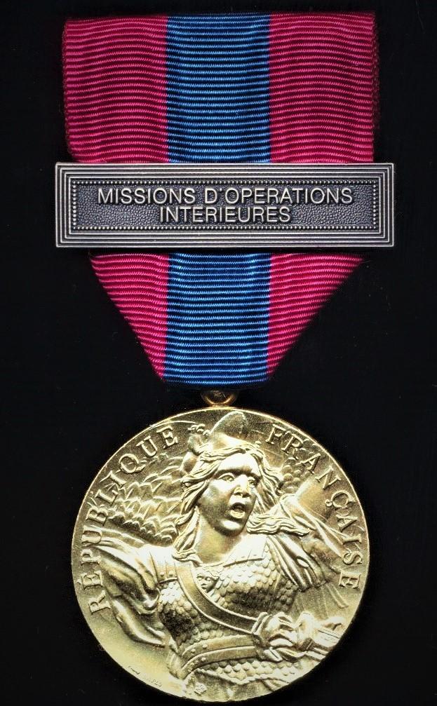 France: National Defence Medal (Medaille de la Defense Nationale). Paris Mint model. 3rd Class, or 'Bronze' grade with clasp 'Missions D'Operations Interieures'