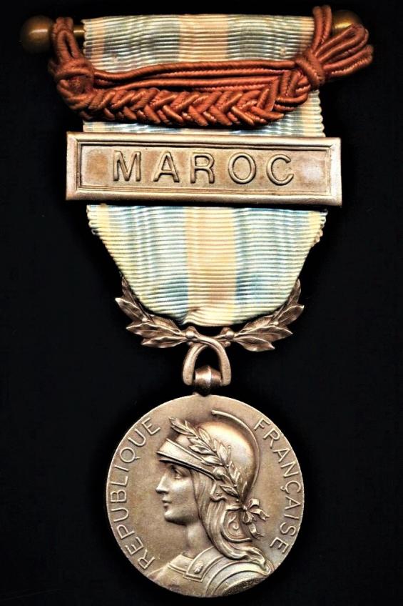 France: Colonial Medal (la Medaille Coloniale). Second type official Paris Mint medal with single sided wreath suspension. With clasp 'Maroc' and draped with 'Fourragere' in the colours of the Legion D'Honneur