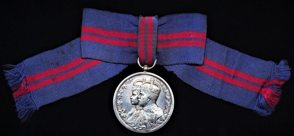 Delhi Durbar Medal 1911. Silver issue. 'Female' issue mounted on original silk bow riband, as worn by female recipients