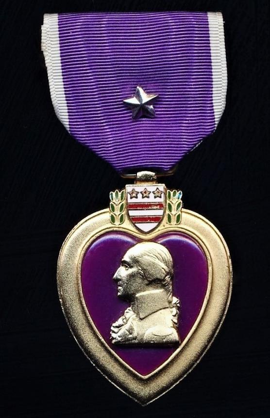 United States: Purple Heart Medal. With 'Silver Star' device. The device indicating an award to United States Navy, United States Marine Corps or United States Coast Guard personnel who have been wounded in action on multiple occasions