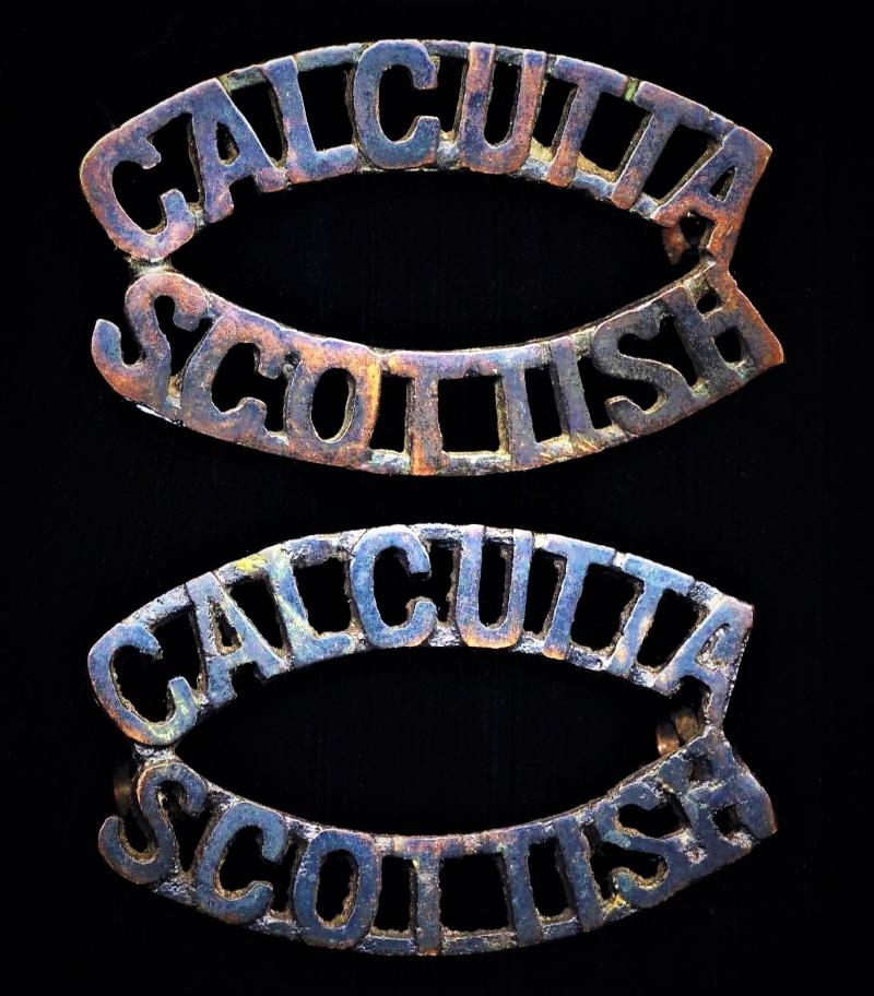 British India: Calcutta Scottish (Auxiliary Force India). Pair ( x 2) Shoulder title. Blackened Brass pattern