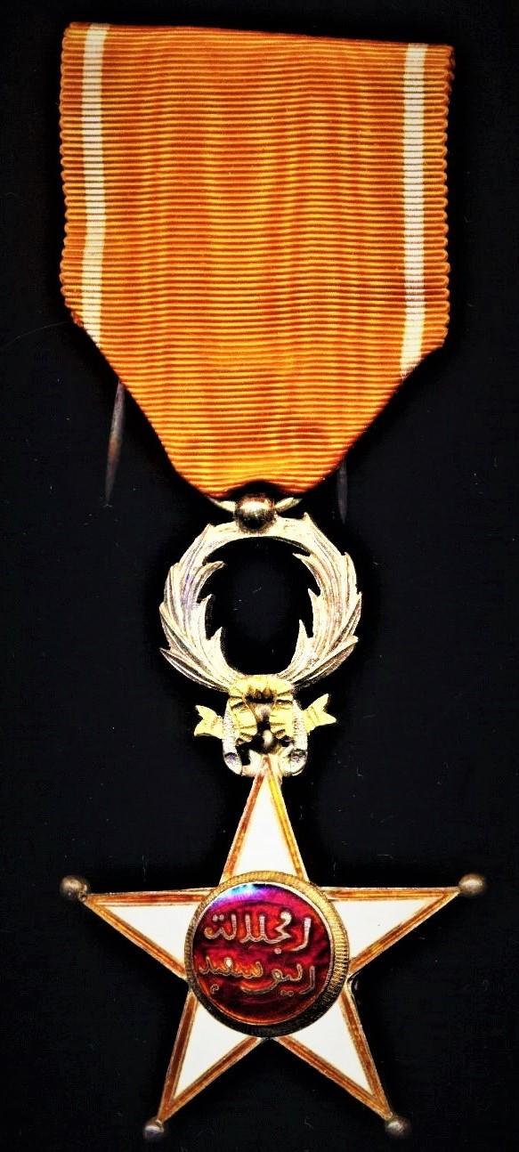 Morocco (Kingdom): Order of Ouissam Alaouite (Sharifian Order of Al-Alaoui). Fifth class 'Knight' breast badge on second type riband '1934-'. Silver gilt & enamel