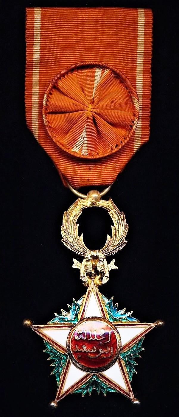 Morocco (Kingdom): Order of Ouissam Alaouite (Sharifian Order of Al-Alaoui). Fourth class 'Officer' breast badge on second type riband '1934-'. Silver gilt & enamel