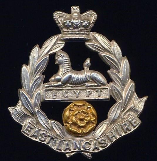 East Lancashire Regiment . Victorian crown. Bi-metal cap badge