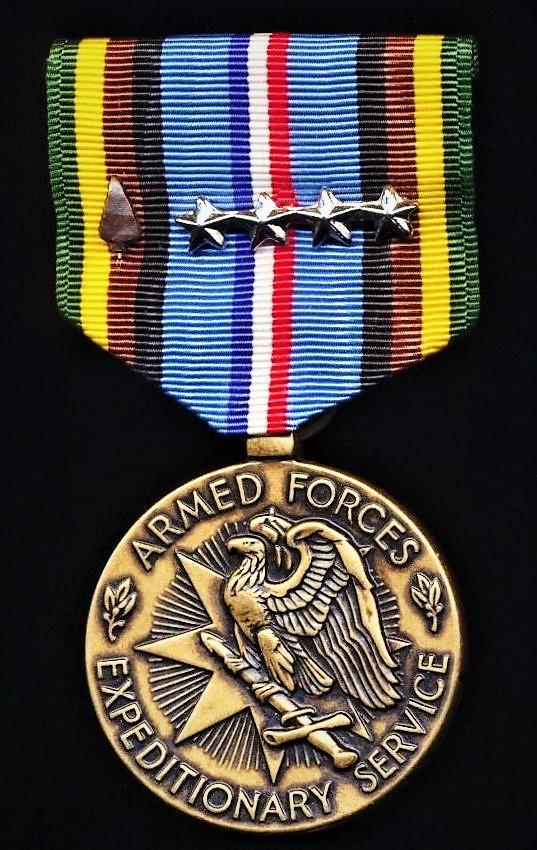 United States: Armed Forces Expeditionary Service Medal. With bronze 'Arrowhead' device & 4 x silver 'Service Stars' on riband