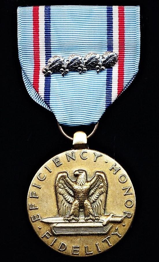 United States: Air Force Good Conduct Medal. With 4 x silver 'Oakleaf Clusters' on riband. Circa 1980-1990 issue