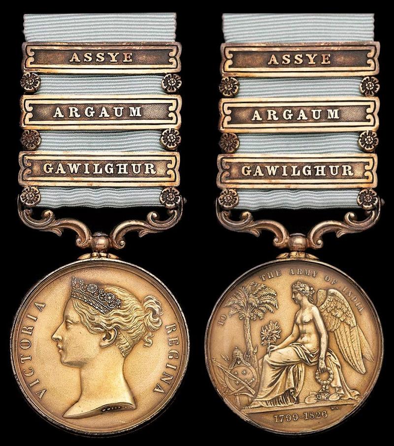 Army of India Medal 1799-1826. With 3 x clasps 'Gawilghur', 'Argaum' & 'Assye'.Gilt in glazed lunettes