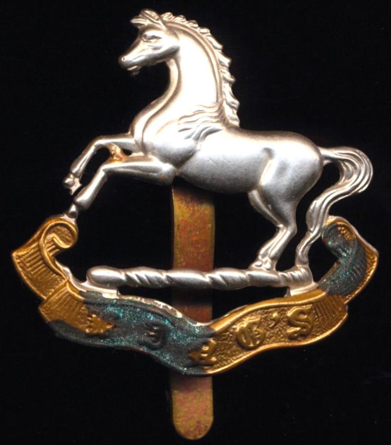 The King's Regiment. Bi-metal cap badge. Circa 1914-1953