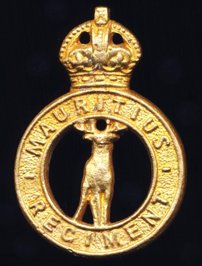 British Empire (Indian Ocean): Mauritius Regiment. A King's Crown 'Theatre Made' sand-cast brass cap badge, circa 1942-46