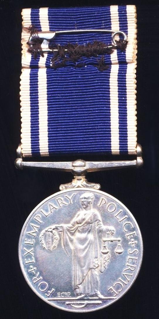 Police Long Service and Good Conduct Medal. EIIR second type legend (Const. Charles E. Maughan)