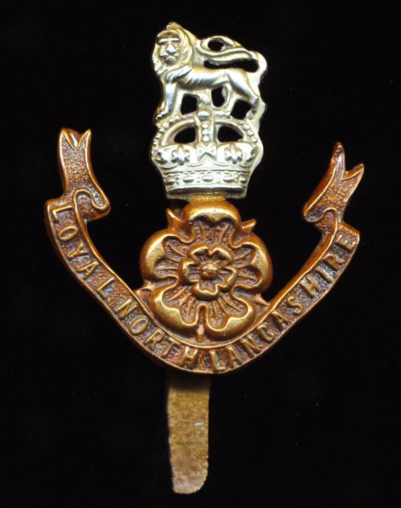 Loyal North Lancashire Regiment. Bi-metal 'King's Crown' cap badge, Circa 1914-1952