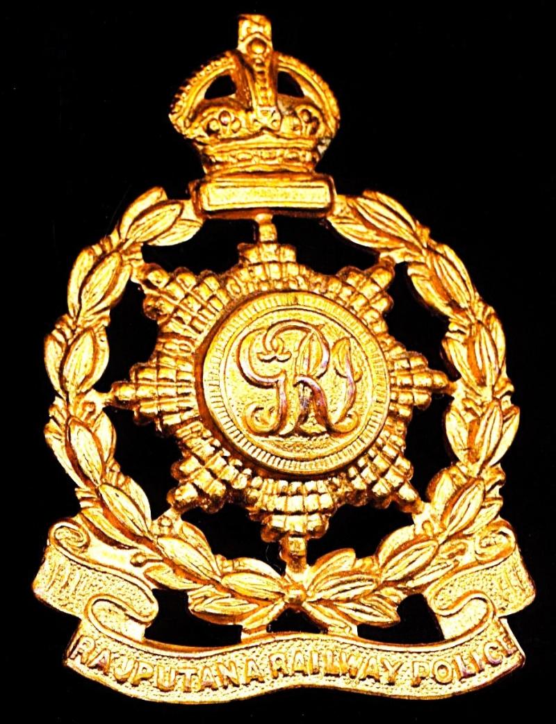 British India: Rajputana Railway Police (Rajasthan). King's Crown die-struck gilt gilding-metal cap badge GV era. Circa 1912-1935