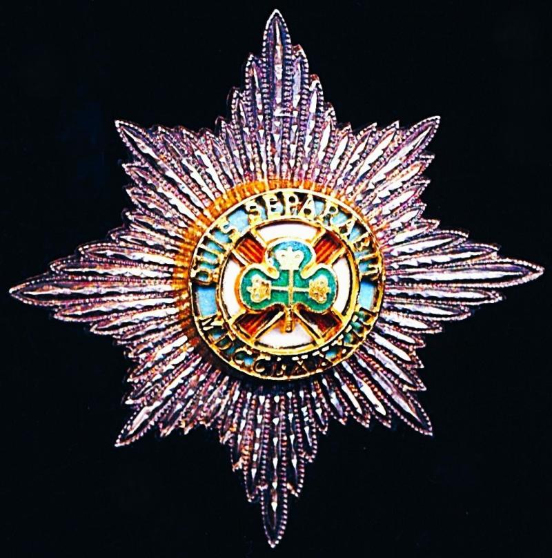 Irish Guards. Officer's silver plated, gilt & enamel cap badge