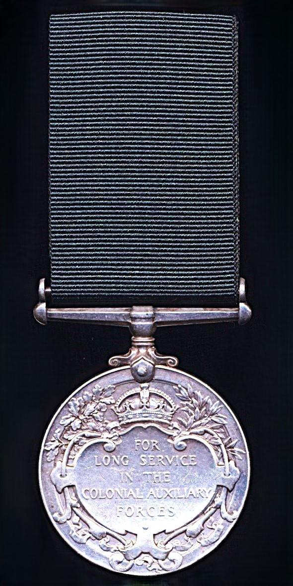 Colonial Auxiliary Forces Long Service medal. GV first issue, with swivel suspender (No. C.Q.M.Sjt. James Jayawardena, Ceylon L.I.)