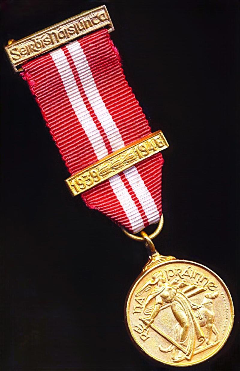 Ireland: Emergency Medal 1939-45. On 'Armed Forces' riband. With ornate integral top bar and 1 x further service dated clasp '1939-1946'. This the variant issue (miniature medal)